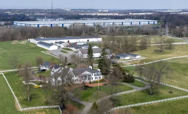 A stately southern mansion sits close to a proposed ICE detention center, top, in a small community in western Maryland known as a destination for weekend bicyclists and Civil War history buffs in Williamsport, Md., Thursday, March 26, 2026. (AP Photo/Steve Helber)