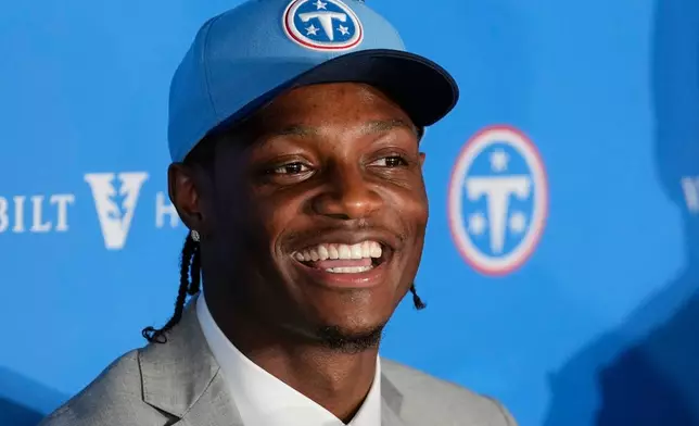 Tennessee Titans first round draft pick Carnell Tate responds to questions during a news conference at the NFL football team's training facility Friday, April 24, 2026, in Nashville, Tenn. (AP Photo/George Walker IV)