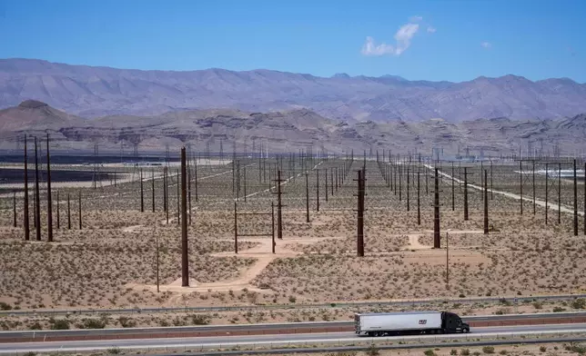 A truck is driven past electrical infrastructure, Thursday, April 2, 2026, in North Las Vegas. (AP Photo/Ty ONeil)