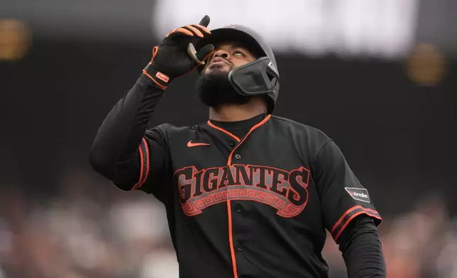 San Francisco Giants' Heliot Ramos celebrates after hitting a home run against the Miami Marlins during the eighth inning of a baseball game Saturday, April 25, 2026, in San Francisco. (AP Photo/Jeff Chiu)
