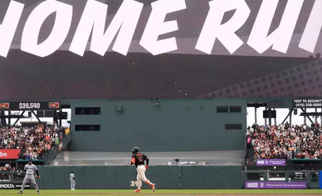 San Francisco Giants' Casey Schmitt (10) runs the bases after hitting a two-run home run during the sixth inning of a baseball game against the Miami Marlins Saturday, April 25, 2026, in San Francisco. (AP Photo/Jeff Chiu)
