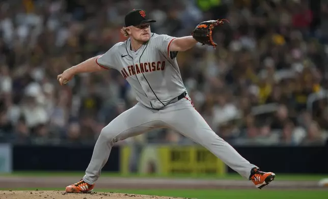 San Francisco Giants starting pitcher Logan Webb works against a San Diego Padres batter during the first inning of a baseball game Tuesday, March 31, 2026, in San Diego. (AP Photo/Gregory Bull)