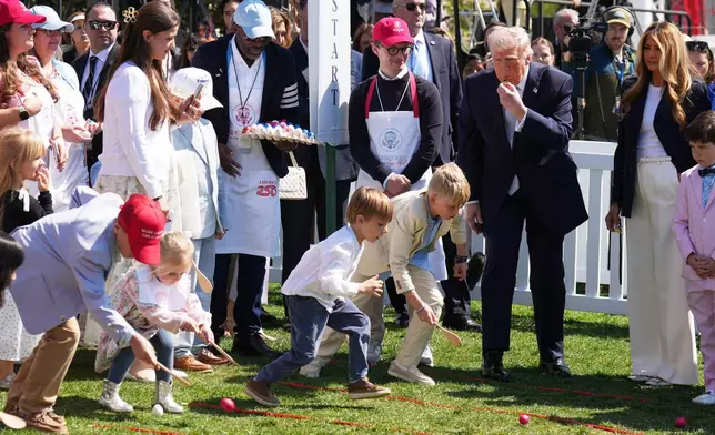 President Donald Trump and first lady Melania Trump participate in the White House Easter Egg Roll on the South Lawn of the White House, Monday, April 6, 2026, in Washington. (AP Photo/Mark Schiefelbein)