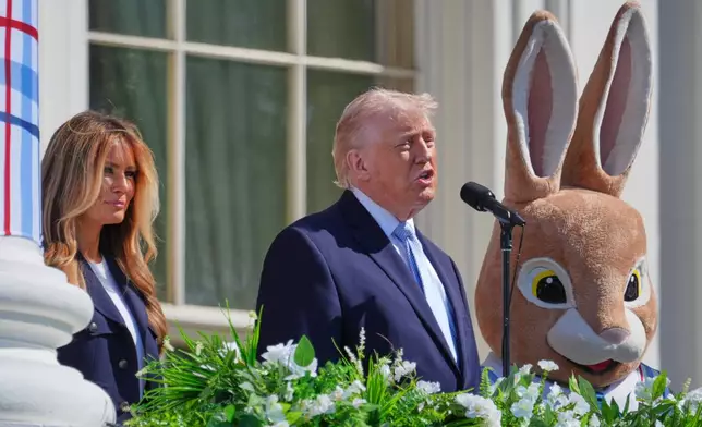 President Donald Trump and first lady Melania Trump participate in the White House Easter Egg Roll on the South Lawn of the White House, Monday, April 6, 2026, in Washington. (AP Photo/Mark Schiefelbein)