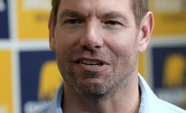 California gubernatorial candidate Rep. Eric Swalwell, D-Calif., talks with reporters after holding a town hall meeting in Sacramento, Calif., Tuesday, April 7, 2026. (AP Photo/Rich Pedroncelli)
