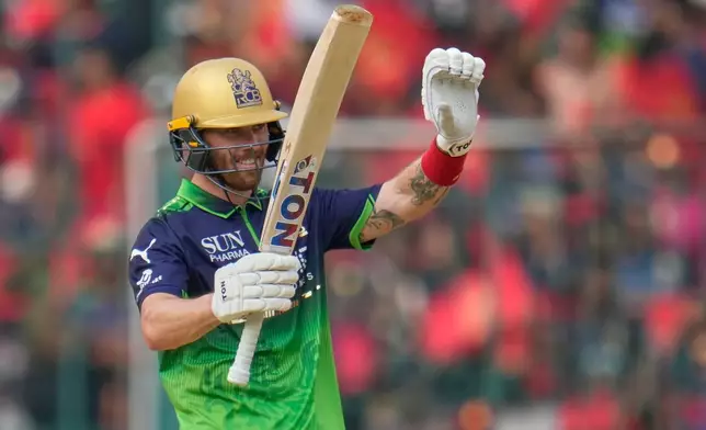 Royal Challengers Bengaluru's Phil Salt celebrates his fifty runs during the Indian Premier League cricket match between Royal Challengers Bengaluru and Delhi Capitals in Bengaluru, India, Saturday, April 18, 2026. (AP Photo/Aijaz Rahi)