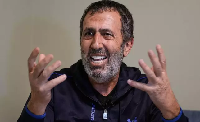 Hassan, the father of Zeinab al-Jabali, 10, who was killed on March 5, 2026, in an Israeli airstrike that hit her house in Libbaya village, east of Lebanon, speaks during an interview at the office of Dr. Ghassan Abu Sitta Fund, in Beirut, Lebanon, Thursday, March 19, 2026. (AP Photo/Bilal Hussein)