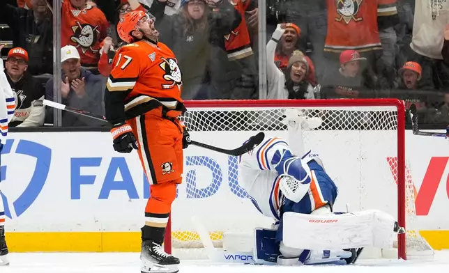 Anaheim Ducks left wing Alex Killorn, left, celebrates his goal as Edmonton Oilers goaltender Connor Ingram sits in goal during the second period of Game 3 in the first round of the NHL hockey Stanley Cup playoffs series Friday, April 24, 2026, in Anaheim, Calif. (AP Photo/Mark J. Terrill)