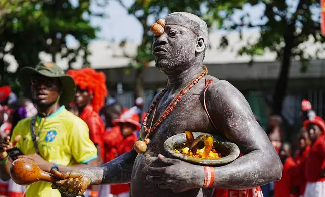 People dressed in costumes perform on the street during the Fanti Carnival in Lagos Nigeria, Monday, April 6, 2026, (AP Photo/Sunday Alamba)