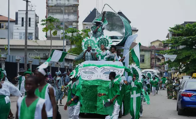 People dressed in costumes perform on the street during the Fanti Carnival in Lagos Nigeria, Monday, April 6, 2026, (AP Photo/Sunday Alamba)