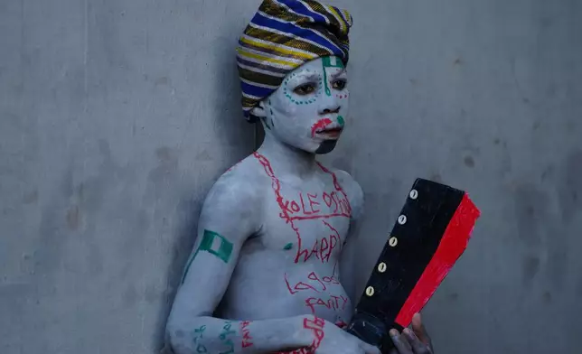 A boy who painted his body attends the Fanti Carnival, in Lagos, Nigeria, Monday, April 6, 2026. (AP Photo/Sunday Alamba)
