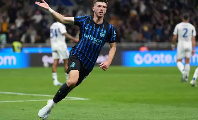 Inter Milan's Petar Sucic celebrates after scoring his side's third goal during the Italian Cup, return-leg soccer match between Inter Milan and Como, in Milan, Italy, Tuesday, April 21, 2026. (AP Photo/Luca Bruno)