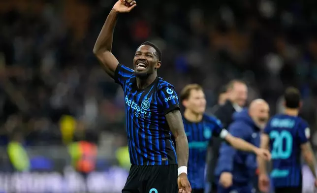 Inter Milan's Marcus Thuram celebrates after the Italian Cup, return-leg soccer match between Inter Milan and Como, in Milan, Italy, Tuesday, April 21, 2026. (AP Photo/Luca Bruno)
