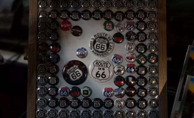 Route 66 buttons are displayed at the Wigwam Motel, a landmark on the historic highway, in Holbrook, Ariz., Wednesday, Nov. 19, 2025. (AP Photo/Jae C. Hong)
