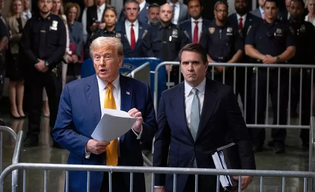 FILE - President Donald Trump, stands with then-defense attorney Todd Blanche, May 14, 2024, in New York. (AP Photo/Craig Ruttle, Pool, file)