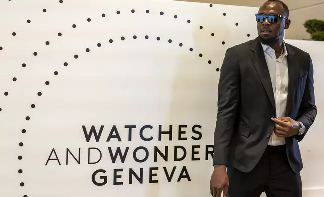 FILE - Former Jamaican sprinter Usain Bolt arrives for a photo call into Hublot stand, during the "Watches and Wonders Geneva" luxury watch fair, in Geneva, Switzerland, April 2, 2025. (Salvatore Di Nolfi/Keystone via AP, file)