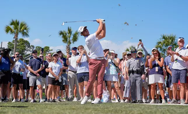 Viktor Hovland, of Norway, hits from the waste area on the 10th hole during the second round at the RBC Heritage golf tournament Friday, April 17, 2026, in Hilton Head, S.C. (AP Photo/Mike Stewart)