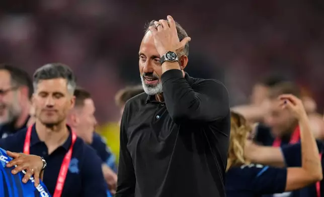 Real Sociedad's head coach Pellegrino Matarazzo celebrates after winning the Copa del Rey final soccer match between Atletico Madrid and Real Sociedad in Seville, Spain, Saturday, April. 18, 2026. (AP Photo/Jose Breton)