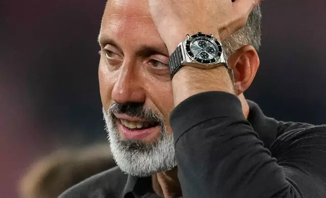 Real Sociedad's head coach Pellegrino Matarazzo celebrates after winning the Copa del Rey final soccer match between Atletico Madrid and Real Sociedad in Seville, Spain, Saturday, April. 18, 2026. (AP Photo/Jose Breton)