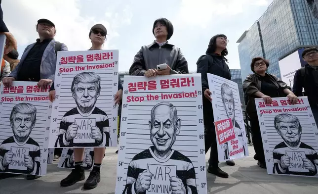 South Korean protesters hold banners depicting U.S. President Donald Trump and Israeli Prime Minister Benjamin Netanyahu during a rally denouncing the U.S. and Israel's attack on Iran, near the U.S. Embassy in Seoul, South Korea, Wednesday, April 29, 2026. (AP Photo/Ahn Young-joon)