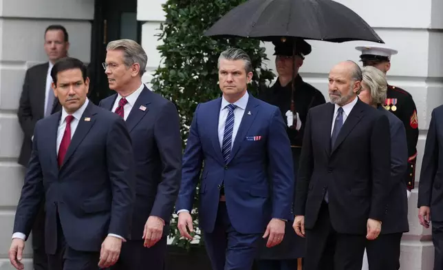 From left, Secretary of State, Marco Rubio, Treasury Secretary Scott Bessent, Secretary of Defense Pete Hegseth and Commerce Secretary Howard Lutnick, arrive before President Donald Trump and first lady Melania Trump greet Britain's King Charles III and Queen Camilla during a State Visit arrival ceremony on the South Lawn of the White House, Tuesday, April 28, 2026, in Washington. (AP Photo/Mark Schiefelbein)