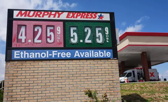 The per-gallon prices for regular unleaded and diesel fuel are displayed on a sign outside a Murphy Express gasoline station, Tuesday, April 28, 2026, in Centennial, Colo. (AP Photo/David Zalubowski)