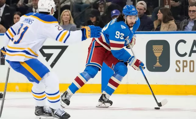 New York Rangers center Mika Zibanejad (93) looks to pass during the first period of an NHL hockey game against Buffalo Sabres, Wednesday, April 8, 2026, in New York. (AP Photo/Yuki Iwamura)