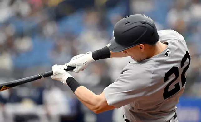 New York Yankees' Ben Rice hits a double during the seventh inning of a baseball game against the Tampa Bay Rays, Sunday, April 12, 2026, in St. Petersburg, Fla. (AP Photo/Jason Behnken)