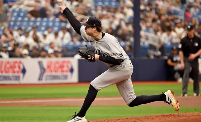 New York Yankees pitcher Cam Schlittler throws during the first inning of a baseball game against the Tampa Bay Rays, Sunday, April 12, 2026, in St. Petersburg, Fla. (AP Photo/Jason Behnken)