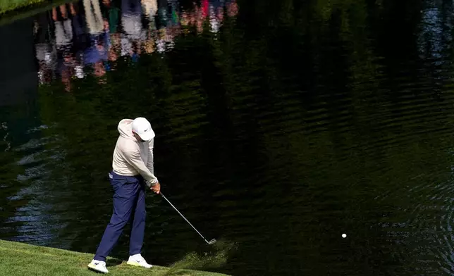 Scottie Scheffler skips a ball on the 16th hole during a practice round ahead of the Masters golf tournament at the Augusta National Golf Club, Wednesday, April 8, 2026, in Augusta, Ga. (AP Photo/David J. Phillip)