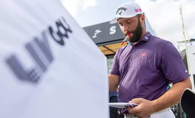 FILE - Captain Jon Rahm of Legion XIII signs autographs after the first round of LIV Golf tournament at Trump National Doral, April 4, 2025 in Miami. (Photo by Scott Taetsch/LIV Golf via AP, File)