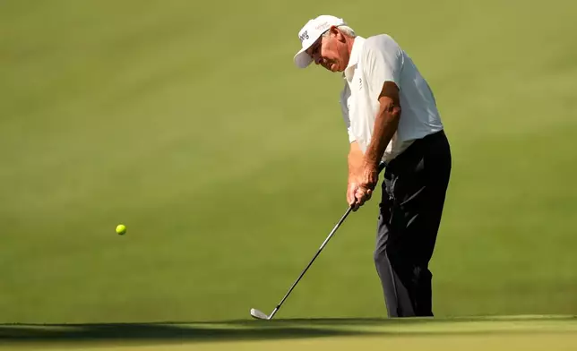Fred Couples chips to the green on the 10th hole during the first round of the Masters golf tournament at the Augusta National Golf Club, Thursday, April 9, 2026, in Augusta, Ga. (AP Photo/Gerald Herbert)