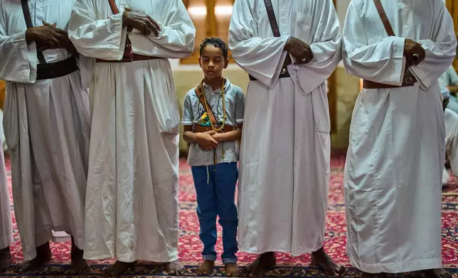 Muslims perform zikr, a Sufi devotional practice, inside the war-damaged Sheikh GaribAllah Mosque in Omdurman, on the outskirts of Khartoum, Sudan, Friday, April 24, 2026. (AP Photo/Bernat Armangue)