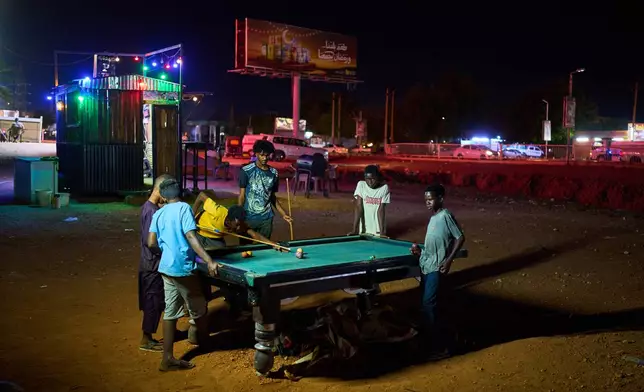 Children play pool in Omdurman, Sudan, on the outskirts of Khartoum, Tuesday, April 21, 2026. (AP Photo/Bernat Armangue)