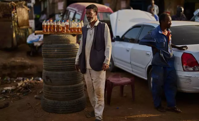 A street vendor sells fuel in Omdurman, Sudan, on the outskirts of Khartoum, Tuesday, April 21, 2026. (AP Photo/Bernat Armangue)