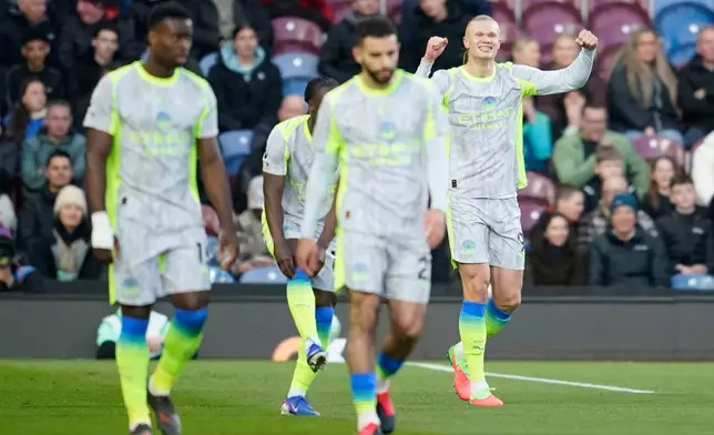 Manchester City's Erling Haaland celebrates after scoring during the Premier League soccer match between Burnley and Manchester City in Burnley, England, Wednesday, April 22, 2026. (AP Photo/Dave Thompson)
