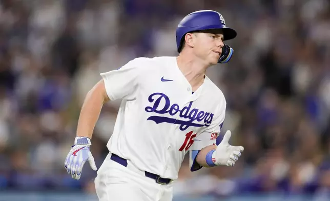 Los Angeles Dodgers' Will Smith runs the bases after hitting a three-run home run during the third inning of a baseball game against the Chicago Cubs Friday, April 24, 2026, in Los Angeles. (AP Photo/Ryan Sun)