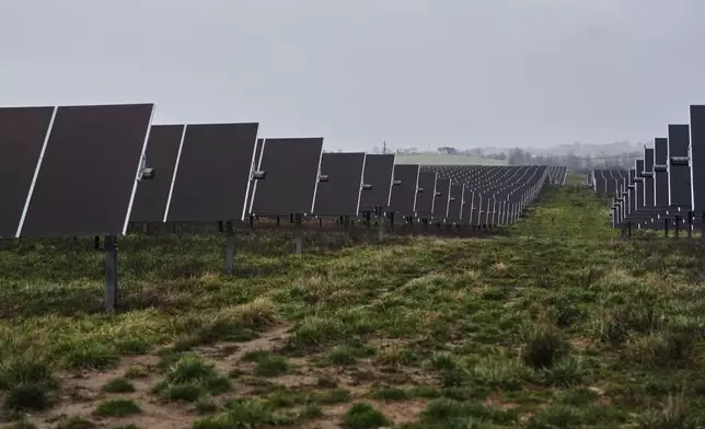 Solar panels operate Wednesday, Jan. 14, 2026, at a farm in Lancaster, Ky. (AP Photo/Joshua A. Bickel)