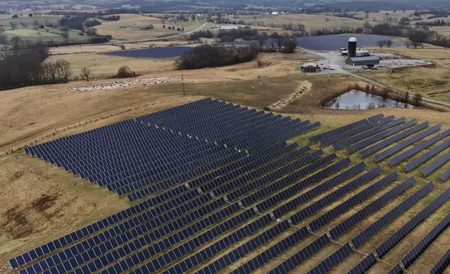 Solar panels operate at a farm Wednesday, Jan. 14, 2026, in Lancaster, Ky. (AP Photo/Joshua A. Bickel)