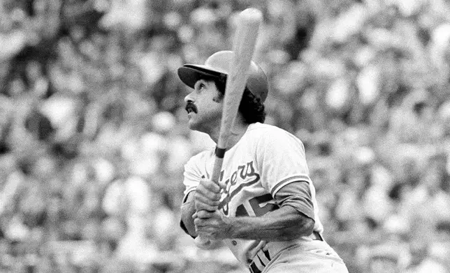 FILE - Los Angeles Dodgers' Davey Lopes hits a home run during an NL playoff baseball game against the Philadelphia Phillies, Thursday, Oct. 5, 1977, Philadelphia. (AP Photo/Rusty Kennedy, File)