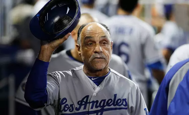 FILE - Los Angeles Dodgers coach Davey Lopes gestures in the dugout during a baseball game in Miami, Sunday, Aug. 12, 2012. (AP Photo/J Pat Carter, File)
