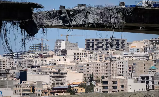 A bridge struck by U.S. airstrikes on Thursday is seen in the town of Karaj, west of Tehran, Iran, Friday, April 3, 2026. (AP Photo/Vahid Salemi)