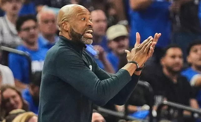 Orlando Magic head coach Jamahl Mosley shouts to playersduring the first half of an NBA play-in tournament basketball game against the Charlotte Hornets, Friday, April 17, 2026, in Orlando, Fla. (AP Photo/John Raoux)