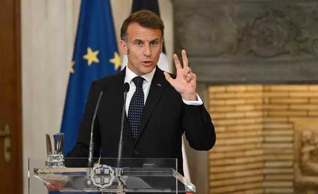 France's President Emmanuel Macron speaks during a media conference with Greece's Prime Minister Kyriakos Mitsotakis at Maximos Mansion in Athens, Greece, Saturday, April 25, 2026. (AP Photo/Michael Varaklas)