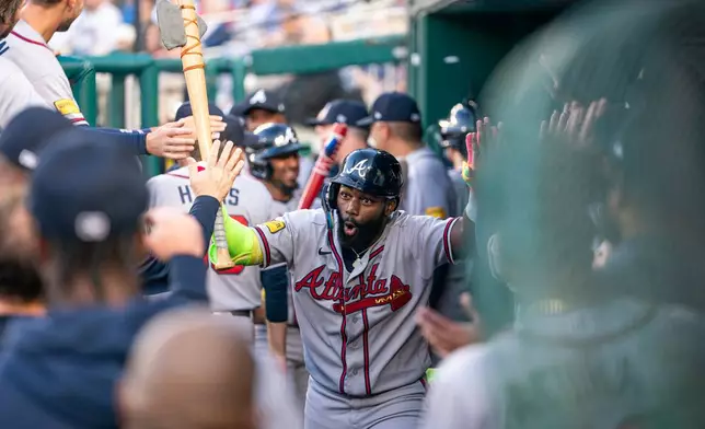 Atlanta Braves Michael Harris II celebrates a home run in the second inning during a baseball game against the Washington Nationals, Wednesday, April 22, 2026, in Washington. (AP Photo/Nathan Howard)