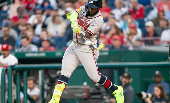 Atlanta Braves Michael Harris II hits a home run in the third inning during a baseball game against the Washington Nationals, Wednesday, April 22, 2026, in Washington. (AP Photo/Nathan Howard)