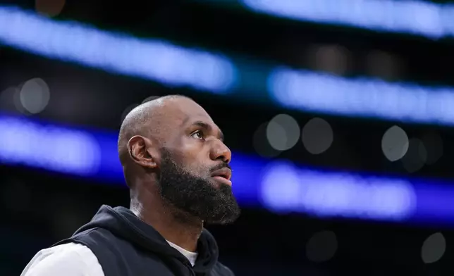 Los Angeles Lakers forward LeBron James looks on before an NBA basketball game against the Phoenix Suns, Friday, April 10, 2026, in Los Angeles. (AP Photo/Jessie Alcheh)