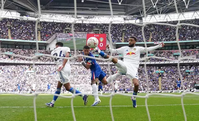 Chelsea's Enzo Fernandez, center, scores his side's opening goal during the FA Cup semifinal soccer match between Chelsea and Leeds in London, England, Sunday, April 26, 2026. (Nick Potts/PA via AP)