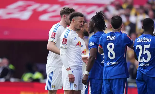 Leeds' Ethan Ampadu, left, and Chelsea's Romeo Lavia argue by the touchline during the FA Cup semifinal soccer match between Chelsea and Leeds in London, England, Sunday, April 26, 2026. (AP Photo/Alastair Grant)