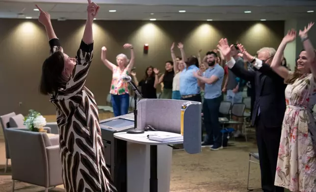 Katharine Wilkinson gives a talk about living with climate uncertainty at American University in Washington on April 14, 2026. (AP Photo/Michael Phillis)